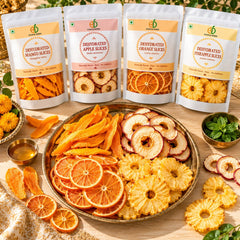 Vrat snack box with dried mango, apple, orange and pineapple slices on a brass thali