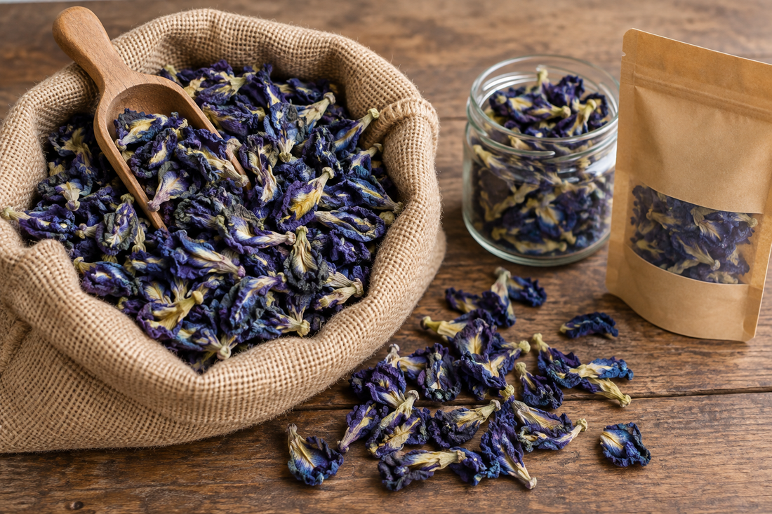 Dried aparajita (butterfly pea) flowers in a bulk jute sack beside a small retail pack
